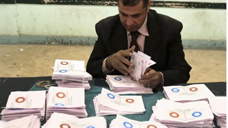 An official counts ballots in Egypt referendu