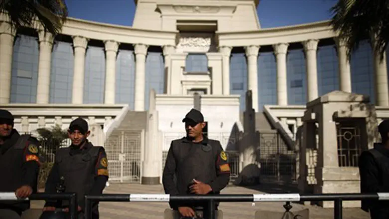 Policemen stand guard outside the constitutio