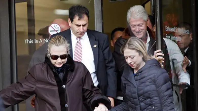 U.S. Secretary of State Hillary Clinton leave