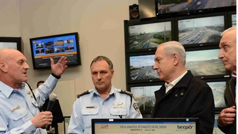 Netanyahu being briefed at Beit Dagan
