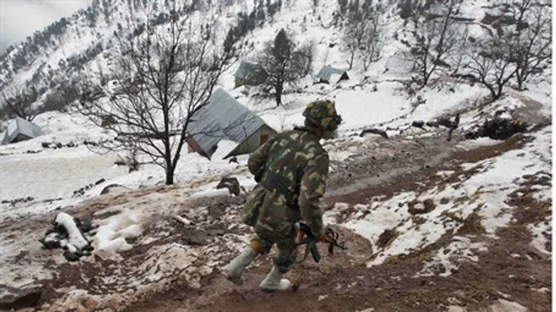 Indian soldier patrolling in Kashmir region