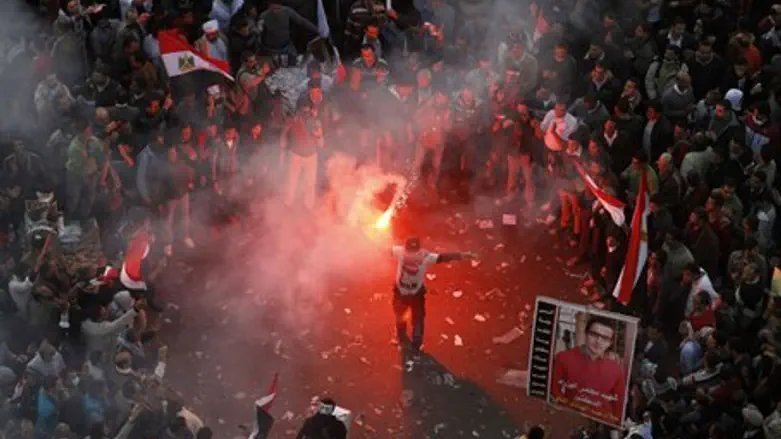 Protester lights flares during a demonstratio