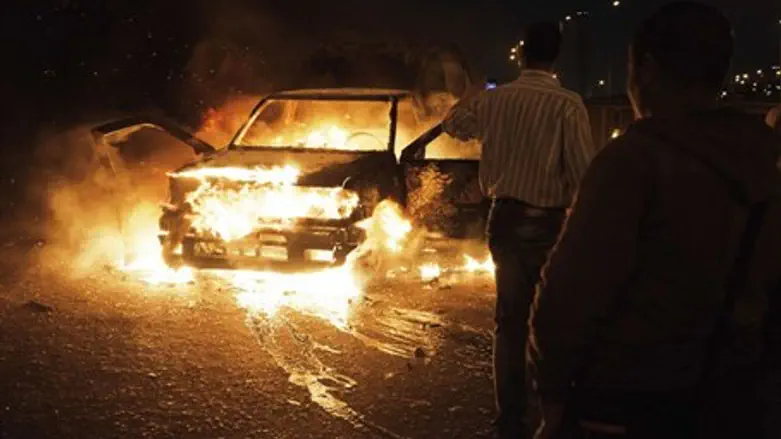 An Egyptian police car set ablaze (file)