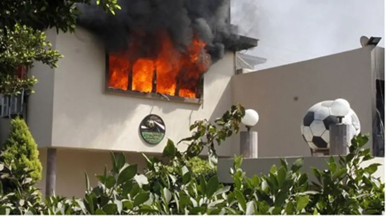 Flames rise from a room at the headquarters o