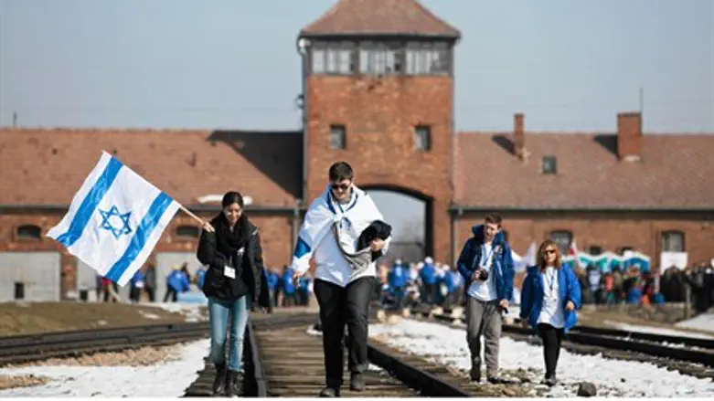 Jews carry Israeli flags as they walk through
