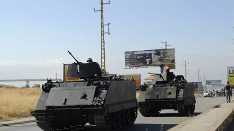 Lebanese Army soldiers secure the site of a r