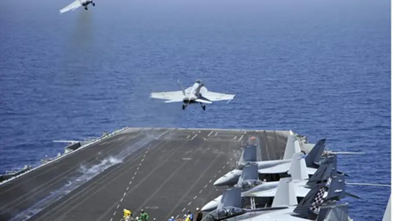 F/A-18F Super Hornets launch from US Navy air