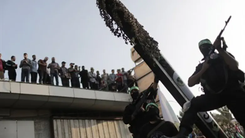 Hamas terrorists parade rockets