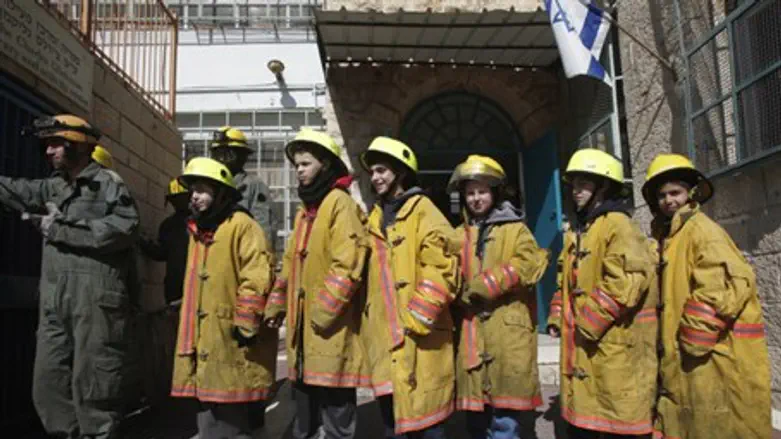 Schoolchildren participating in a fire prepar