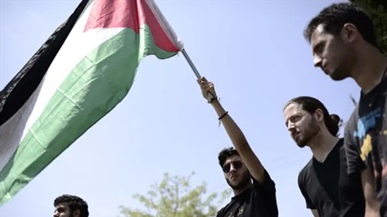 Arab and leftist students wave PLO flag at TA