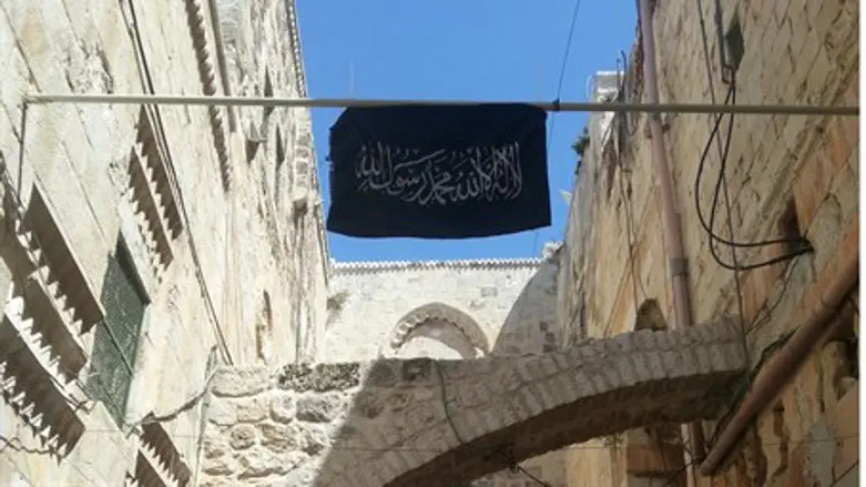 An Al Qaeda flag flying atop the Kotel Hakata