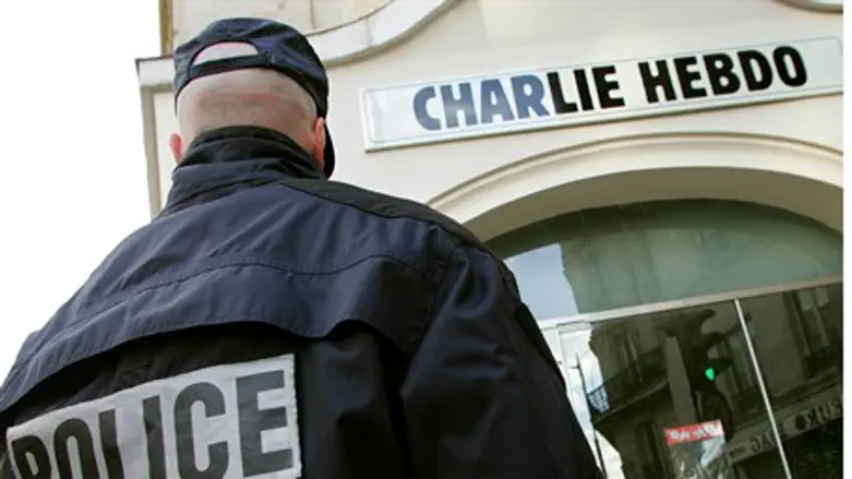 Police in front of Charlie Hebdo's Paris headquarters (file)