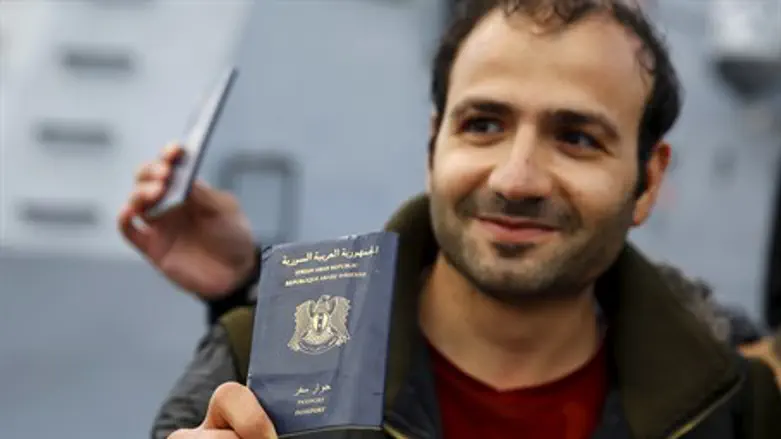 Syrian refugee holds passport (illustration)
