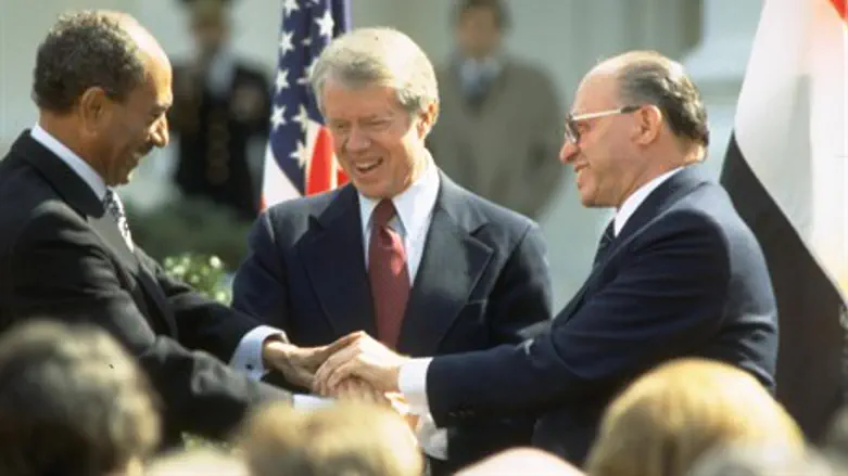Begin (R) and Sadat (L) in famous post-treaty handshake