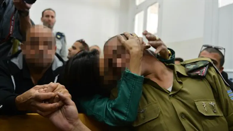 Hevron soldier with his parents in court