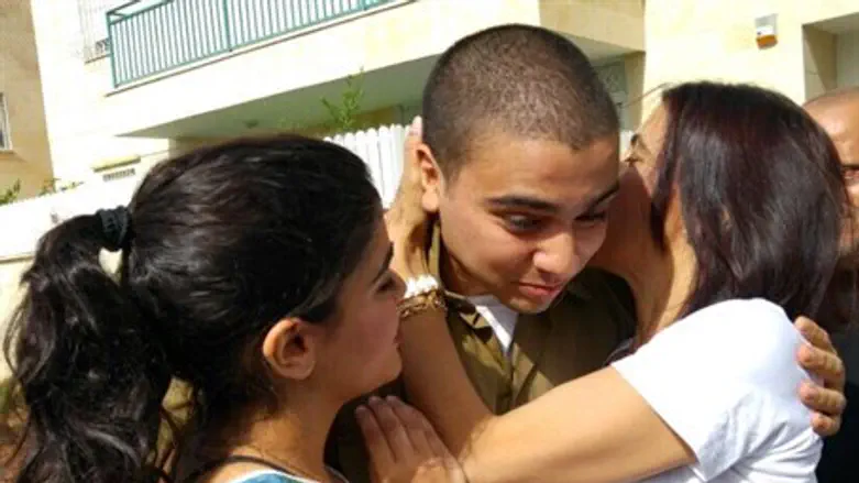 Elor arrives home