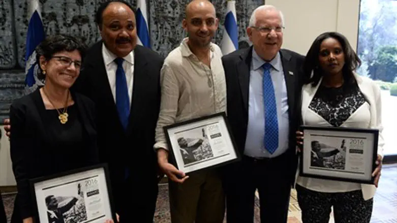 Rivlin with recipients of the Unsung Heroes award