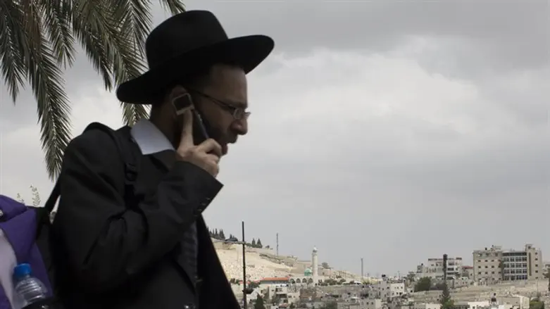 Haredi man on cellphone (Illustration)