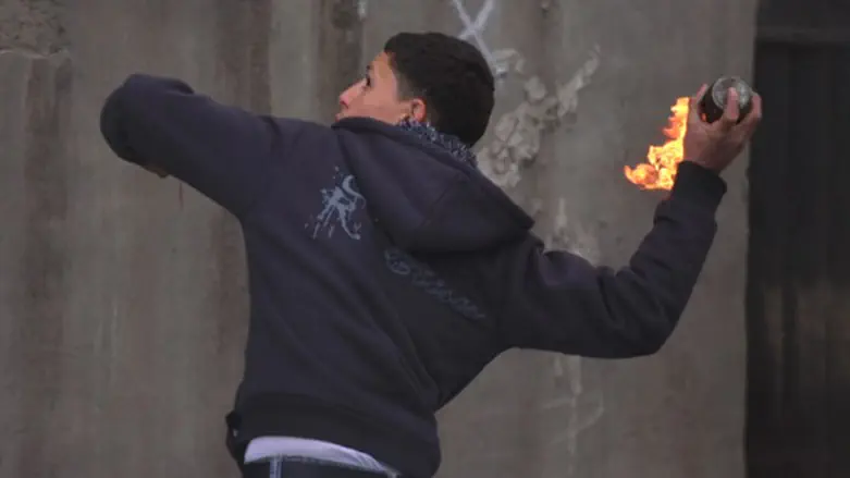 Arab youth throws firebomb