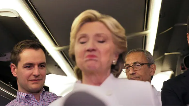 Clinton and campaign manager John Podesta (right)