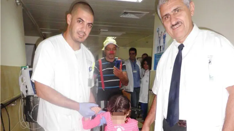 Dr Alexander Lerner, Head of the Orthopedic Department injured Syrian girl