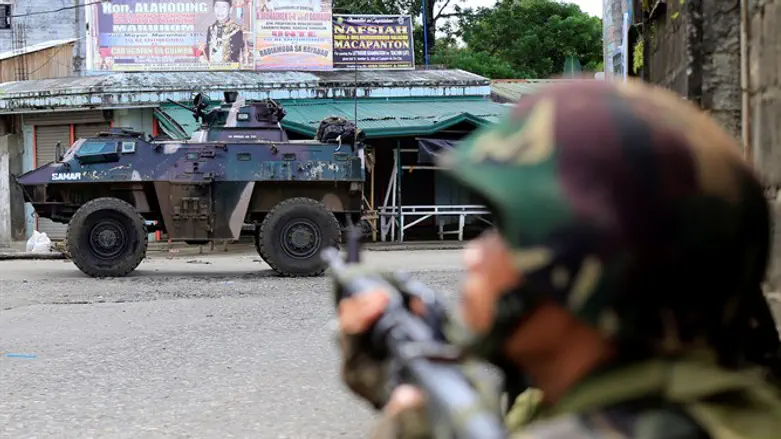 Government troops seen during assault by insurgents from the so-called Maute group