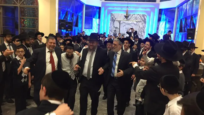 Rabbi Masri dances with community leaders at this week;s Simchat Beit Hashoava celebration