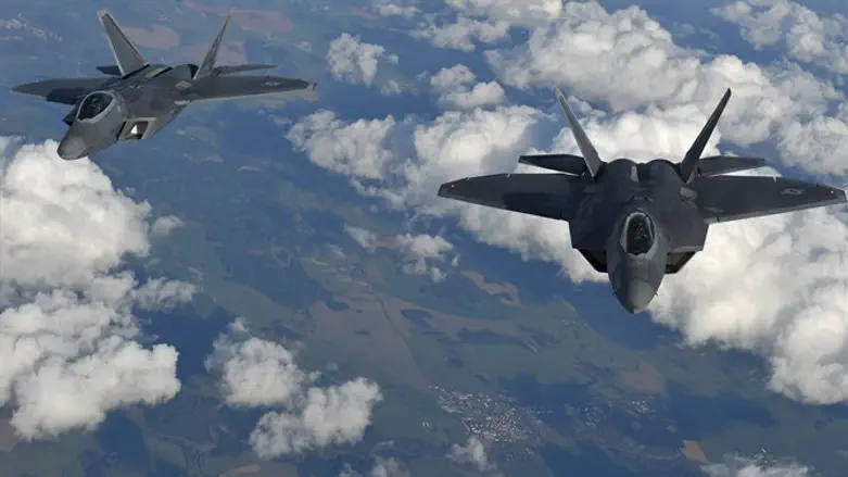Two U.S. F-22 Raptor stealth fighters