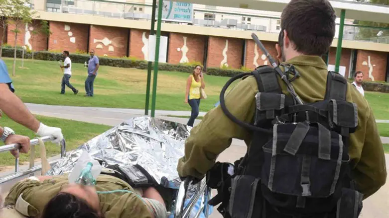 Injured soldier being transported to hospital (illustrative)