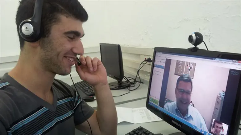 An Israeli high school student videoconferences with a North American baby boomer for a we