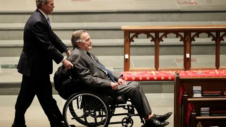 (r)George W. Bush (l) and George H.W. Bush at Barbara Bush's funeral