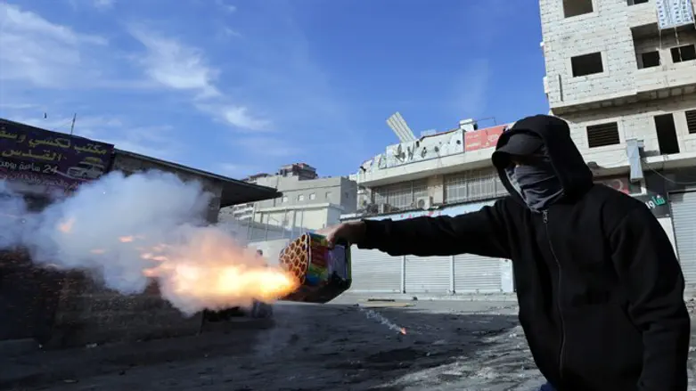Arab rioter shoots fireworks at Israeli police