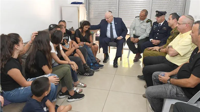 Rivlin with bereaved family