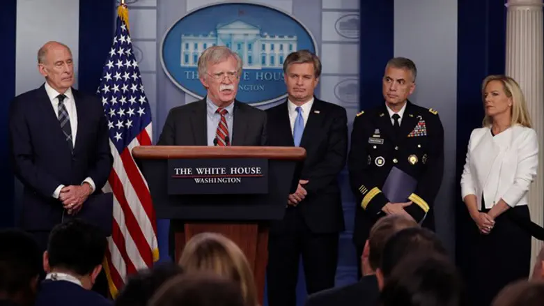 Bolton (podium) holds security briefing in White House press briefing room
