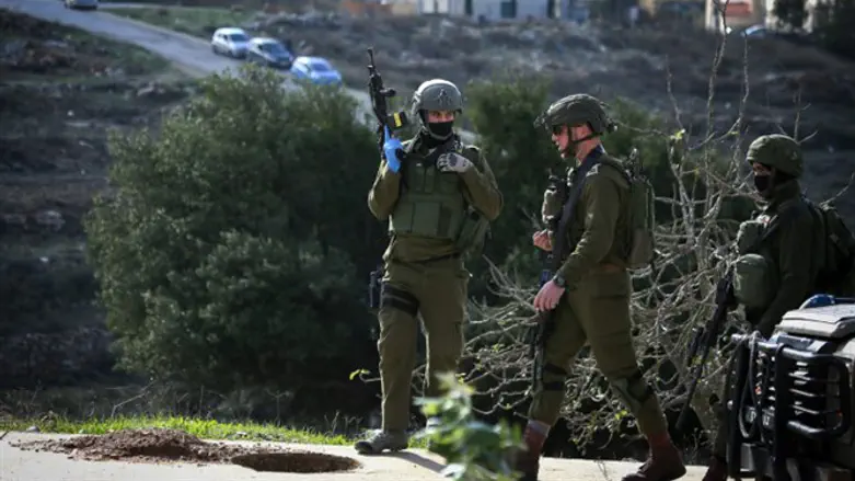 IDF soldiers searching for terrorists near Ramallah after Ofra attack