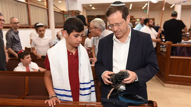 Yitzhak Herzog with one of the bar mitzvah boys