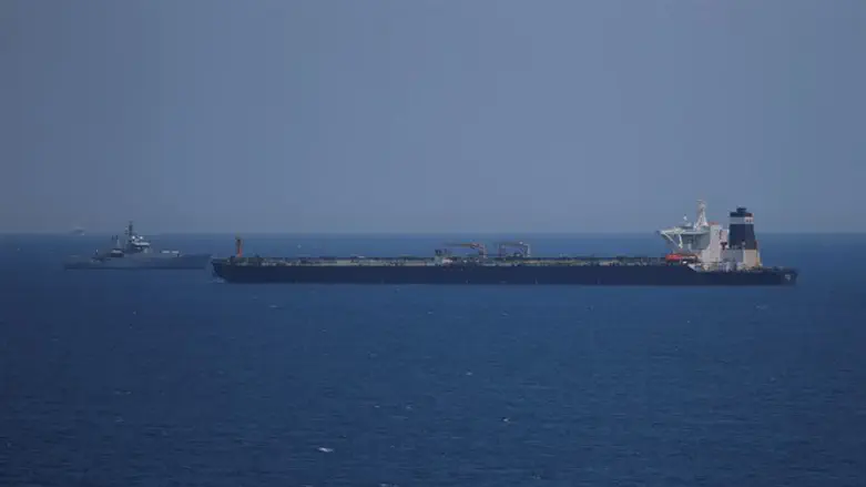 British Royal Navy patrol vessel guards the oil supertanker Grace 1