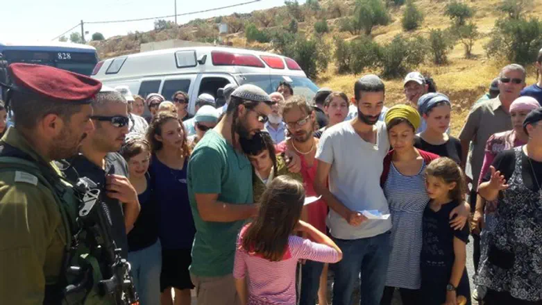 Mark family says Kaddish at the site of the attack