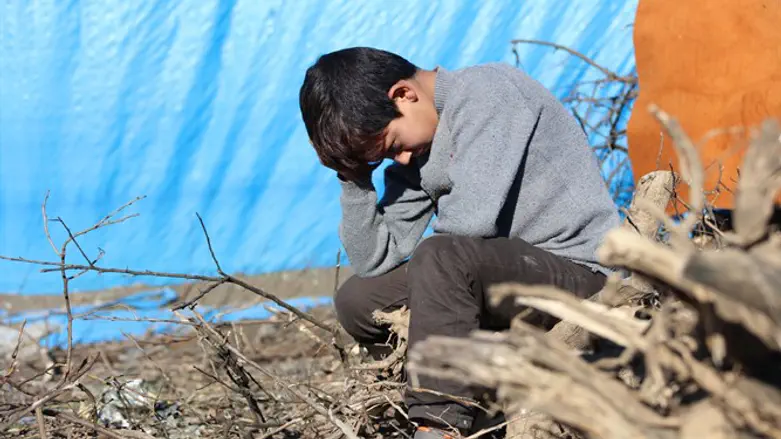 Boy in Syrian refugee camp