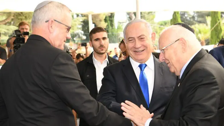 Netanyahu and Gantz shake hands as Rivlin approves