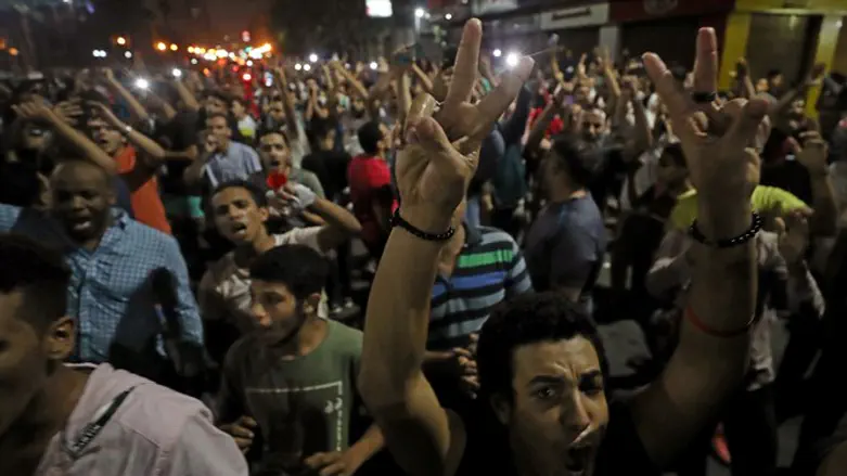 Protesters shouting anti-government slogans in Cairo