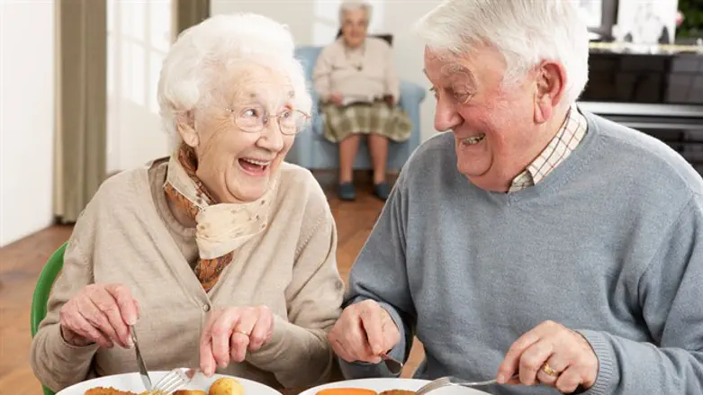 Senior citizens enjoy a meal together