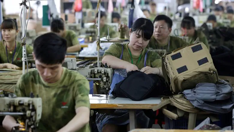 Chinese workers at Yakeda Tactical Gear produce gun cases for sale in the US