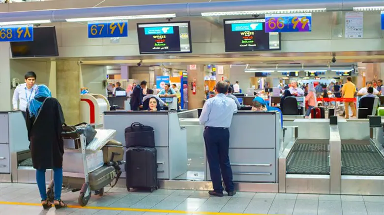 People check in at Tehran's airport