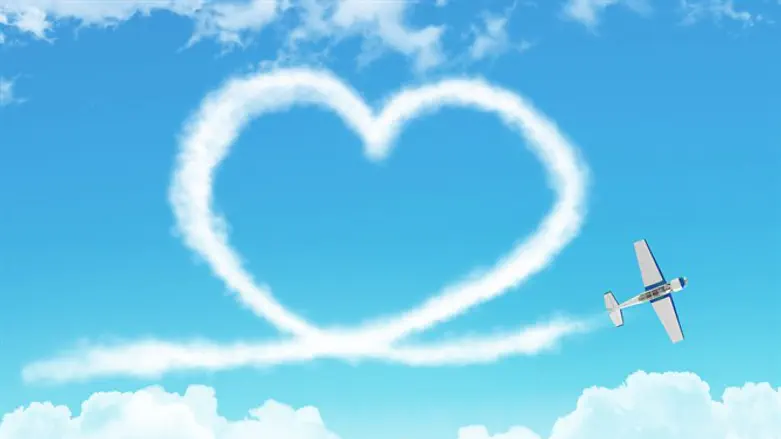 Plane draws heart in sky