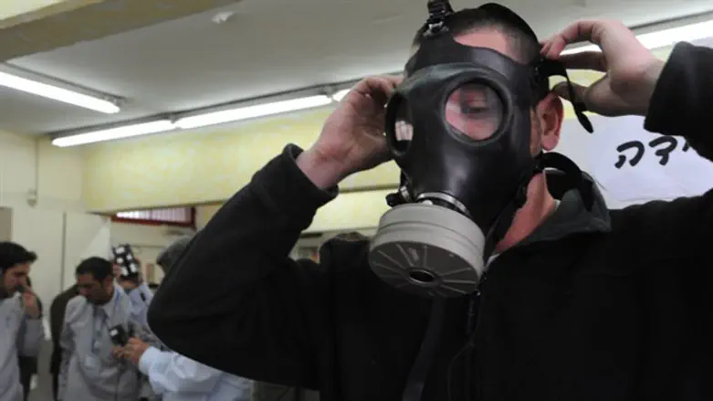 Man tries on gas mask (illustrative)